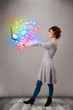 Young lady holding notebook with colorful hand drawn multimedia