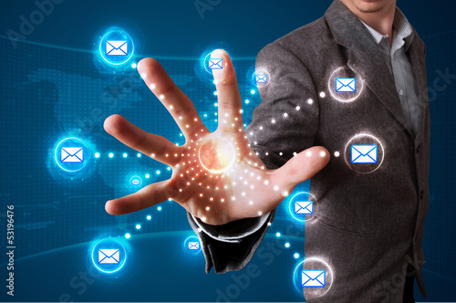 Photo: Businessman pressing virtual messaging type of icons Businessman pressing virtual messaging type of icons