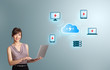 Photo: young woman holding a laptop and presenting cloud computing netw young woman holding a laptop and presenting cloud computing netw