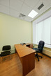 Empty office cabinet with blinds on window