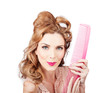 Cute retro female hairdresser with big hair comb