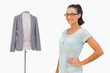 Foto: Designer smiling beside her mannequin Designer smiling beside her mannequin