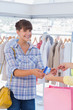 Woman giving her credit card to cashier
