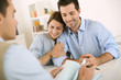 Young couple meeting construction planner