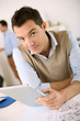 Handsome Guy Working With Tabl...