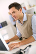 Man Working In Office In Front...