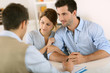 Young couple meeting construction planner