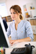 Young woman in office working on desktop