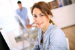 Portrait of cheerful girl in office