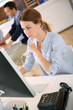 Young woman in office working on desktop