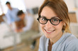 Cheerful student girl wearing eyeglasses