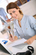 Young woman working on desktop computer