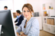 Portrait of cheerful girl in office