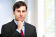 Photo: Handsome businessman in his office Handsome businessman in his office