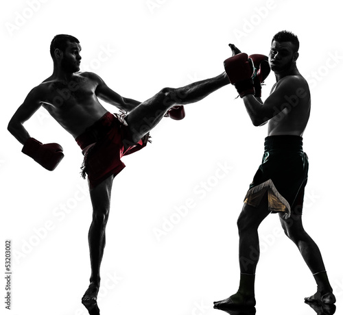 Photo: two men exercising thai boxing silhouette two men exercising thai boxing silhouette