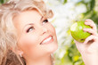 Photo: young beautiful woman with green apple young beautiful woman with green apple