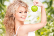 Photo: young beautiful woman with green apple young beautiful woman with green apple