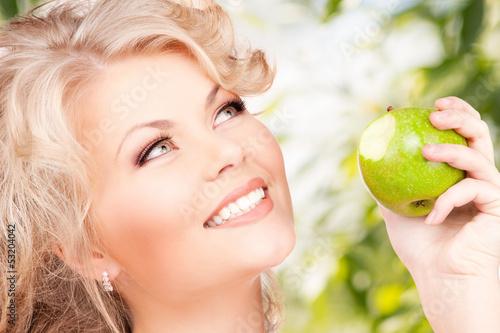 Photo: young beautiful woman with green apple young beautiful woman with green apple