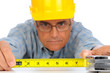 Photo: Construction Worker with Tape Measure Construction Worker with Tape Measure