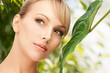 Photo: woman with green leaf woman with green leaf