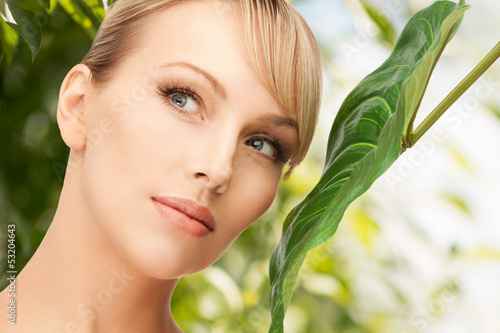 Photo: woman with green leaf woman with green leaf