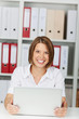 Photo: Happy businesswoman with laptop computer Happy businesswoman with laptop computer