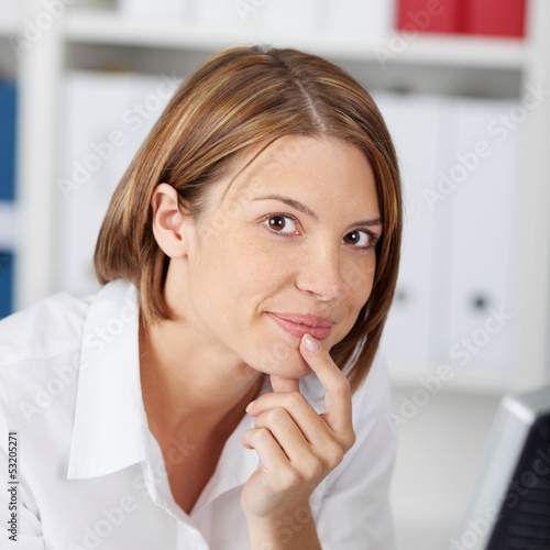 Photo: Portrait of a pensive woman in the office Portrait of a pensive woman in the office