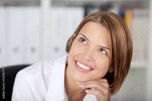 Photo: Portrait of a smiling woman at the office Portrait of a smiling woman at the office