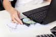 Woman inserting a cd in her laptop
