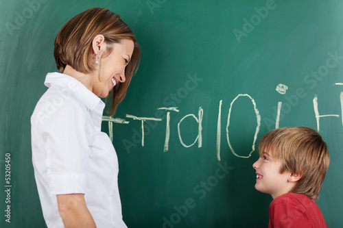 Photo: Happy little boy with his teacher Happy little boy with his teacher