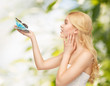 woman with butterfly in hand