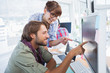 Photo: Pair of photo editors working together Pair of photo editors working together