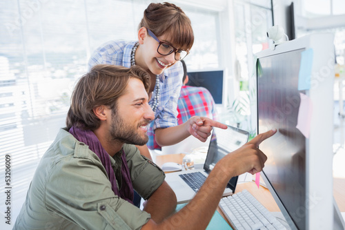 Photo: Pair of photo editors working together Pair of photo editors working together