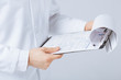 Photo: male doctor holding prescription paper in hand male doctor holding prescription paper in hand