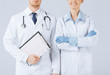 nurse and male doctor holding cardiogram