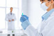 female doctor holding syringe with injection
