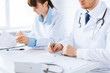 Photo: doctor and nurse writing prescription paper doctor and nurse writing prescription paper