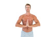 Shirtless man meditating