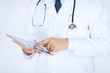 male doctor holding tablet pc