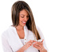 Photo: Woman texting on her phone Woman texting on her phone