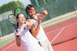 Two Happy Tennis Players with Thumbs Up
