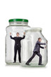 Photo: Young businessman in glass jar Young businessman in glass jar
