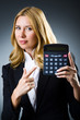 Businesswoman with calculator in business concept