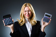 Businesswoman with calculator in business concept