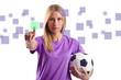 Woman with football pressing virtual buttons