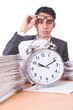 Woman businessman with giant alarm clock