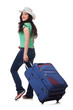 Photo: Young woman with suitcase isolated on white Young woman with suitcase isolated on white