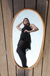 thoughtful woman with her reflection in mirror