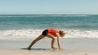 Woman doing exercises at the beach