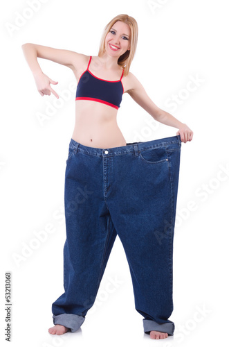 Photo: Dieting concept with oversize jeans Dieting concept with oversize jeans